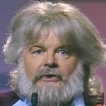 Benny as Kenny Rogers in 'The Monte Carbolic Show'